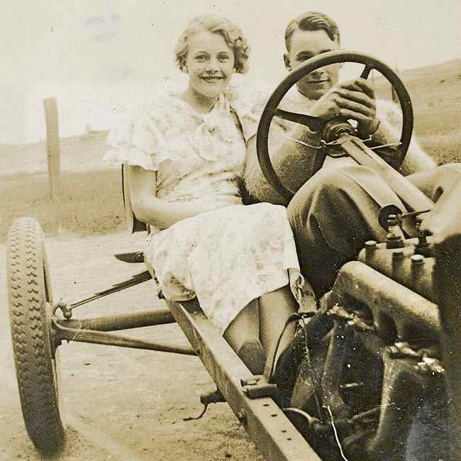 A young man his Model T speedster and his best girl 